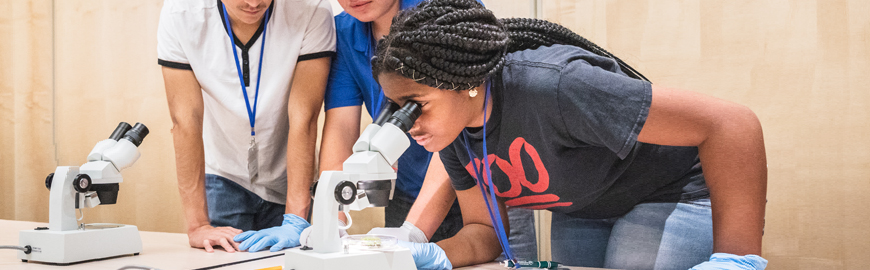 High school students working with lab equipment