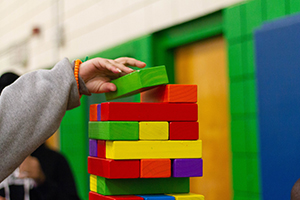 Child's hand building blocks